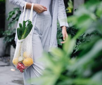 Girl with a bag of fruit