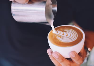 Drawing with milk on a cup of coffee