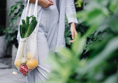 Girl with a bag of fruit